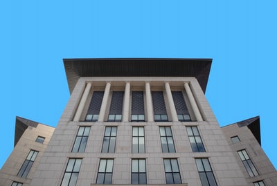 White concrete building under the blue sky during the day
